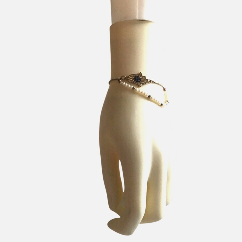 WOMENS ADJUSTABLE BRACELET WITH PEARLS AND EVIL EYE/HAND CHARM